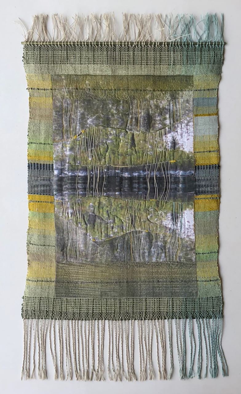 “Reflections/North Lake #2, Eastern Sierra, CA” by Cameron Taylor-Brown, 2023 Materials: linen, silk and paper yarns, silk and cotton fabric, wood and paint