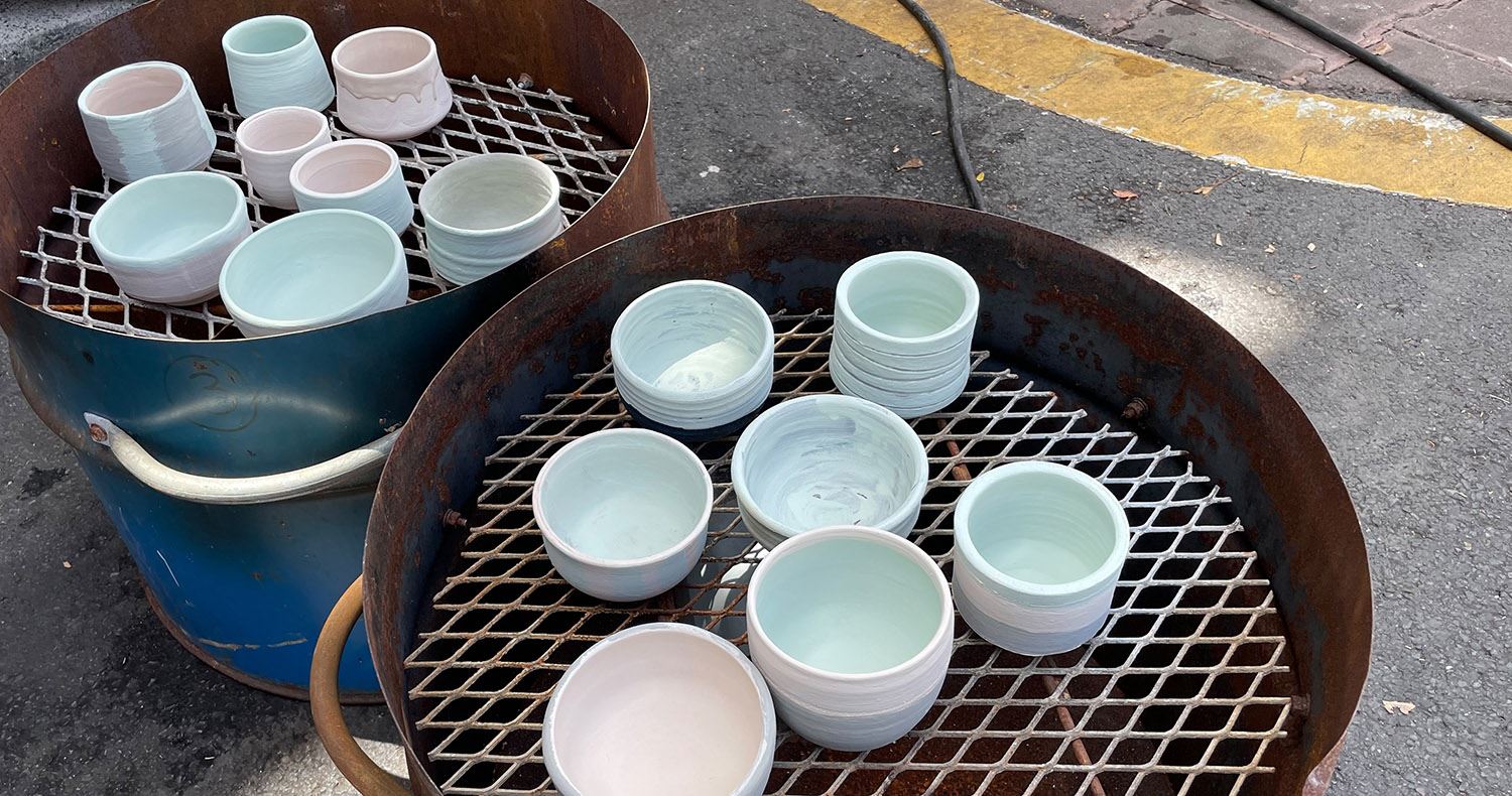 Community Kiln 2023, tea bowls are glazed and loaded into kilns to be fired.